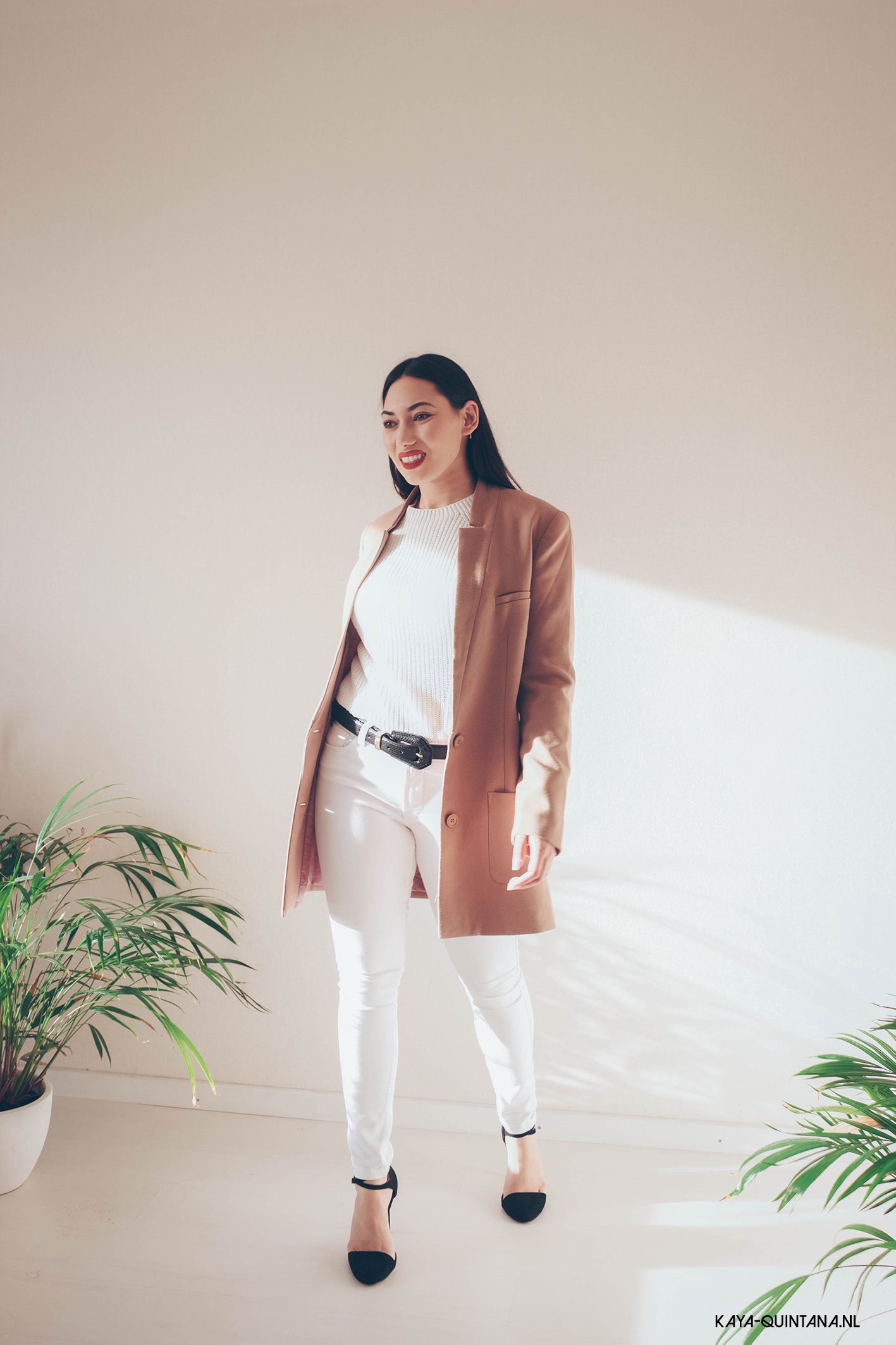 All white outfit with a camel coat
