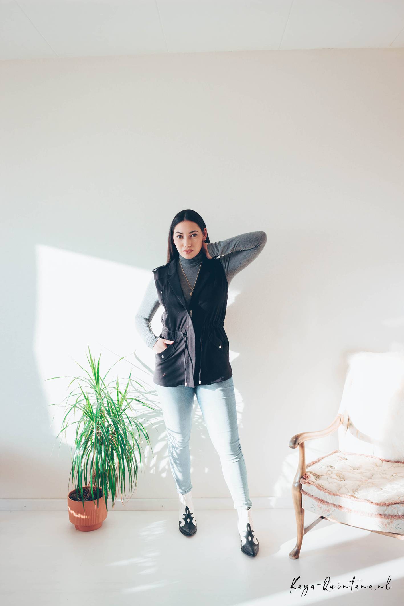 sleeveless jacket with cowboy boots